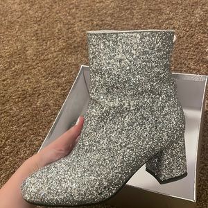 Only worn once. Super cute sparkly silver boots.